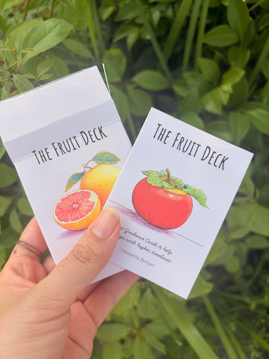 Fruit oracle cards featuring citrus and persimmon illustrations with keywords and affirmation messages.