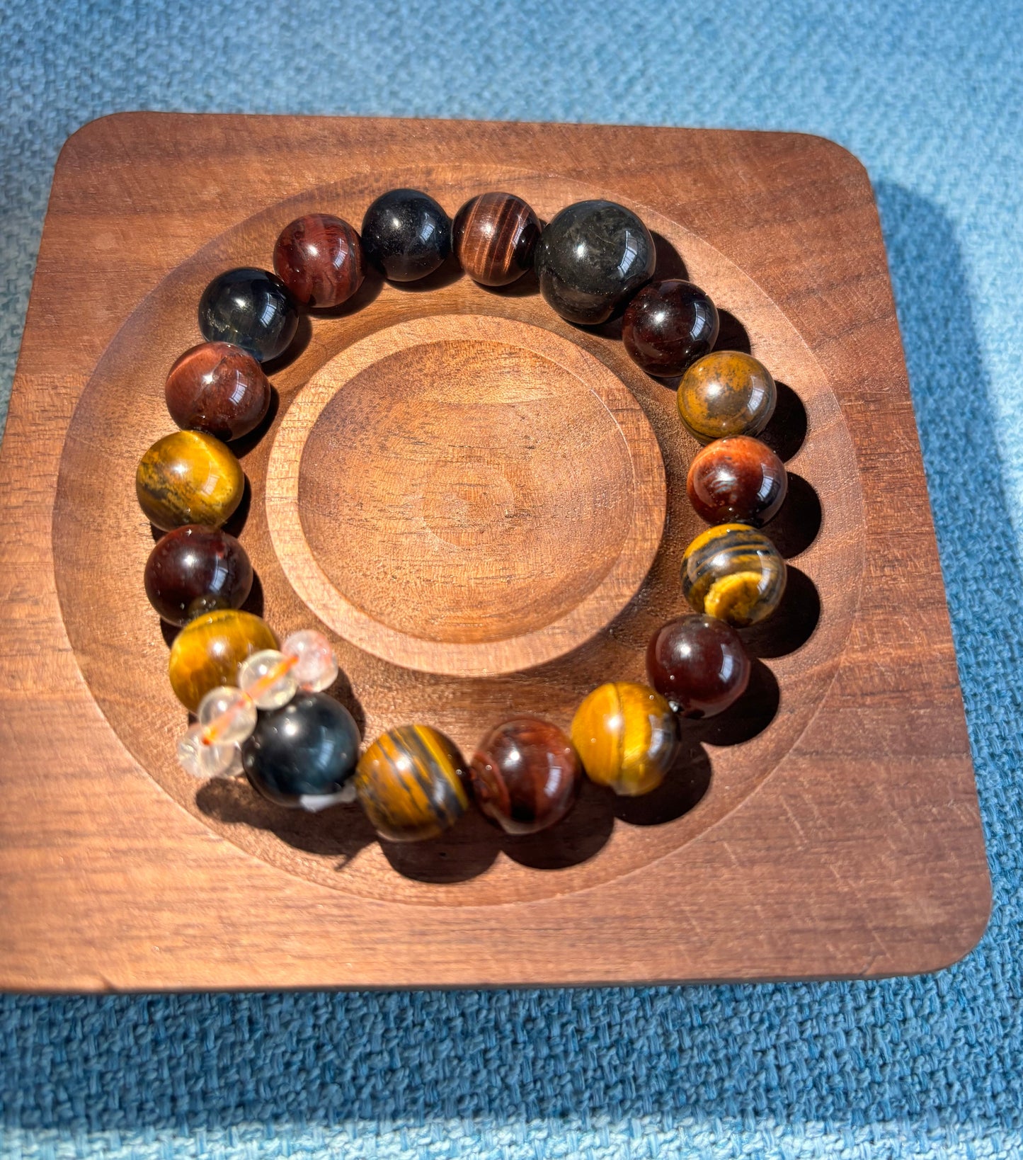 Oracle card displayed beside a custom handmade gemstone bracelet representing the inspiration behind the personalized design.