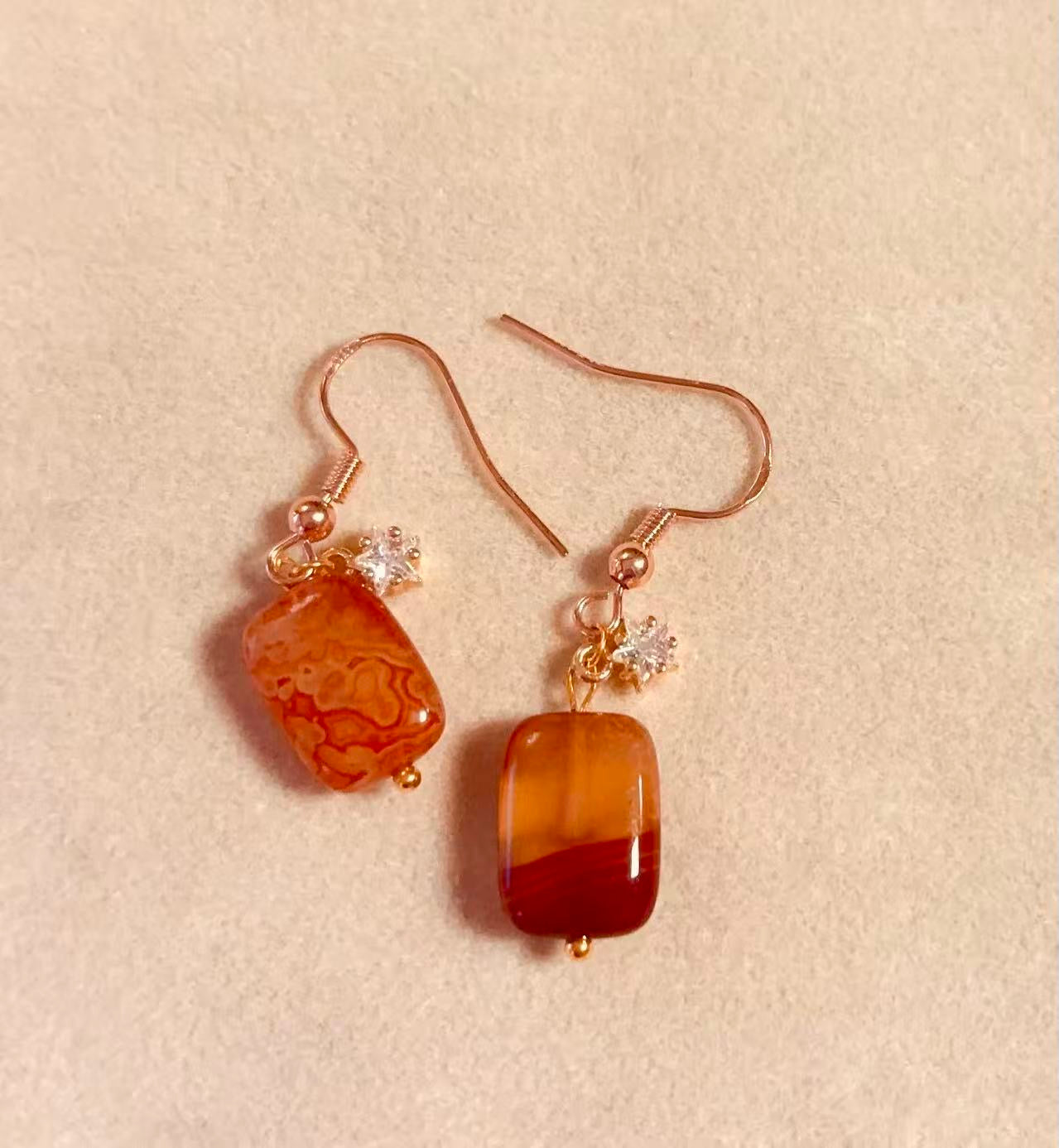 Handmade jewelry by Zenlyart featuring crystal and charm pieces, including earrings, bracelets, and accessories