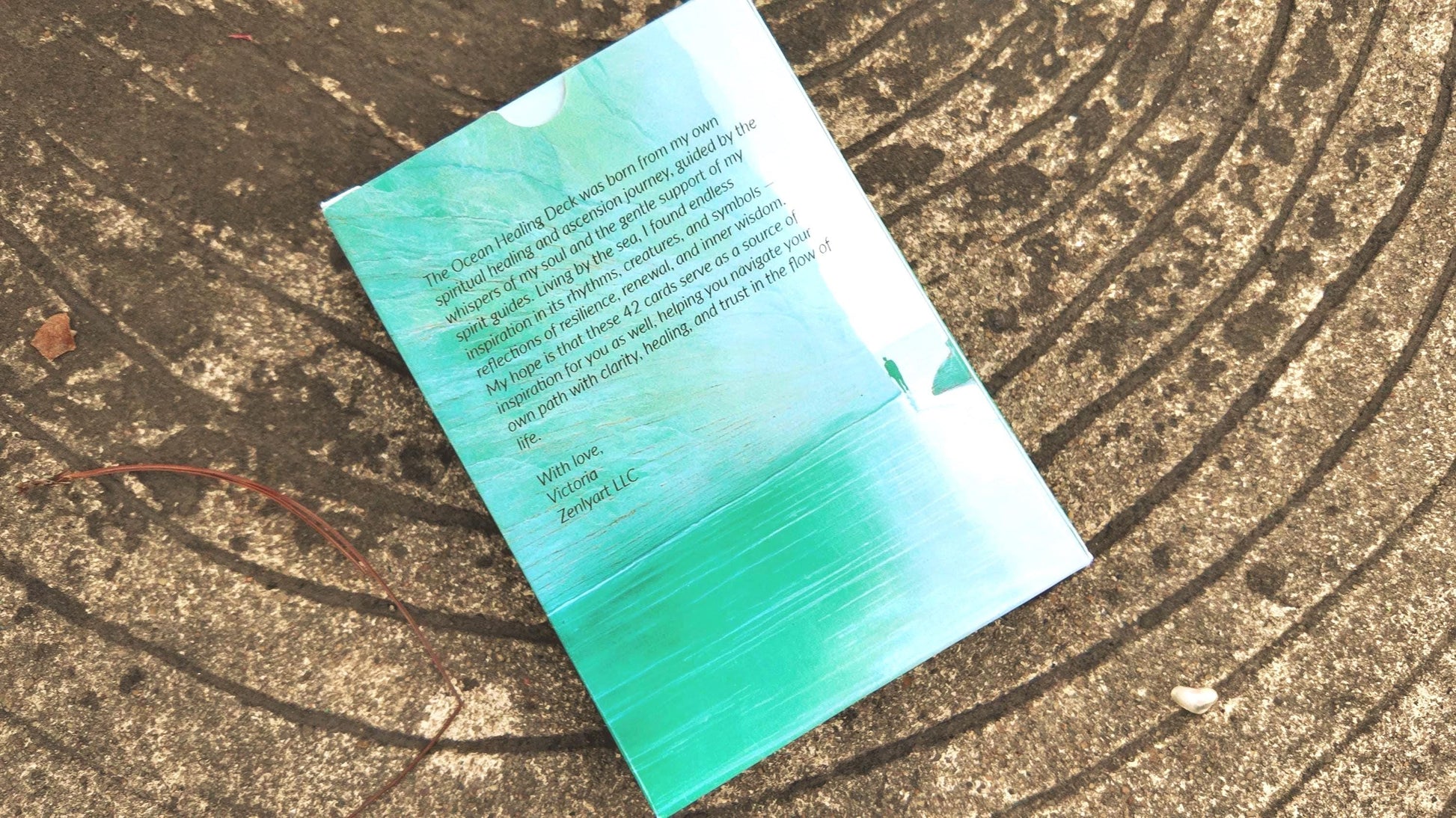 Back of the Ocean Healing Oracle Deck showing the story behind the creation and how to use the cards.
