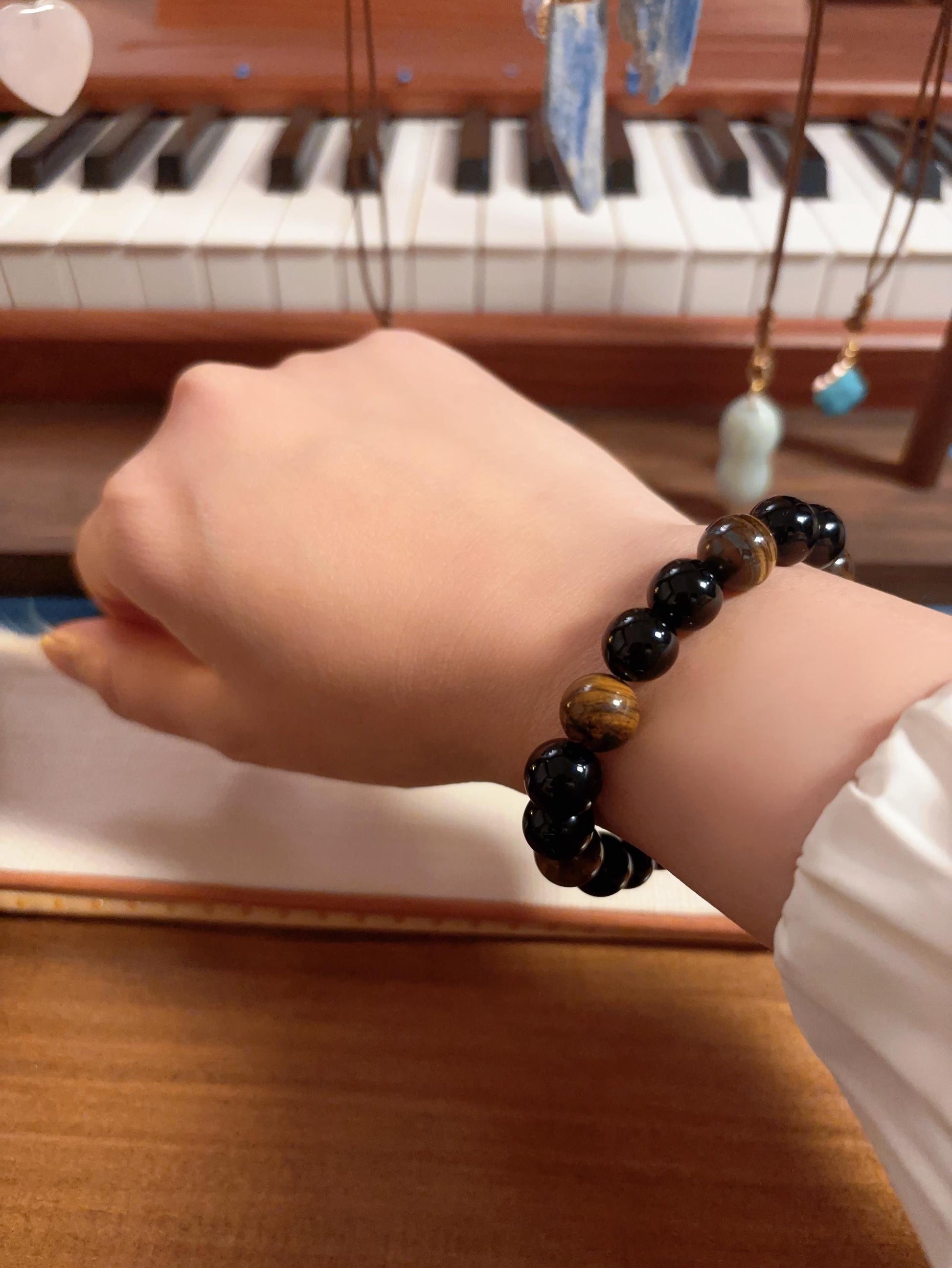 Black onyx bracelet worn on wrist unisex crystal jewelry