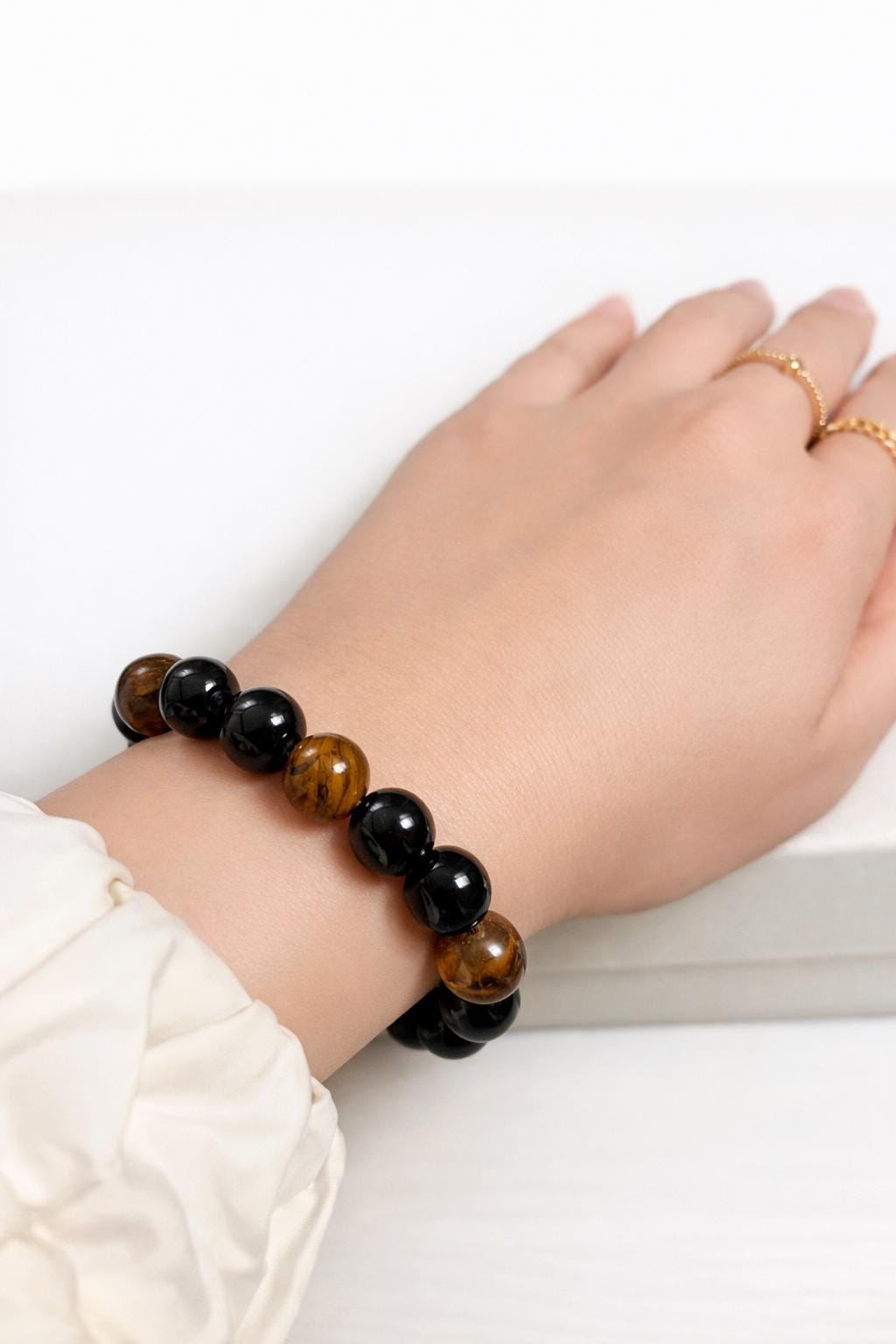 Tiger eye and black onyx grounding bracelet lifestyle photo