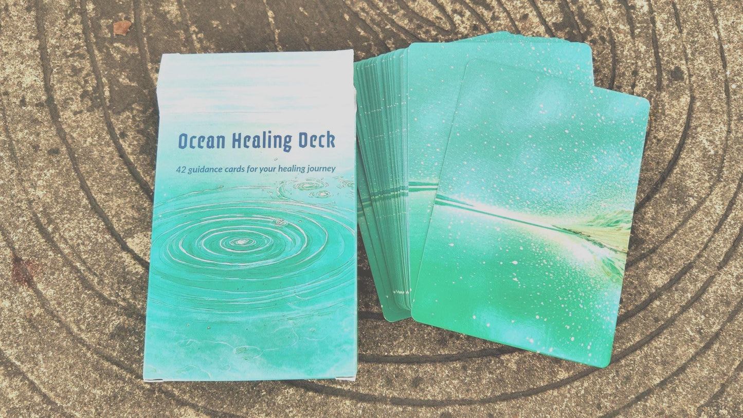 Ocean Healing Deck box with a stack of cards used for spiritual guidance on a textured surface
