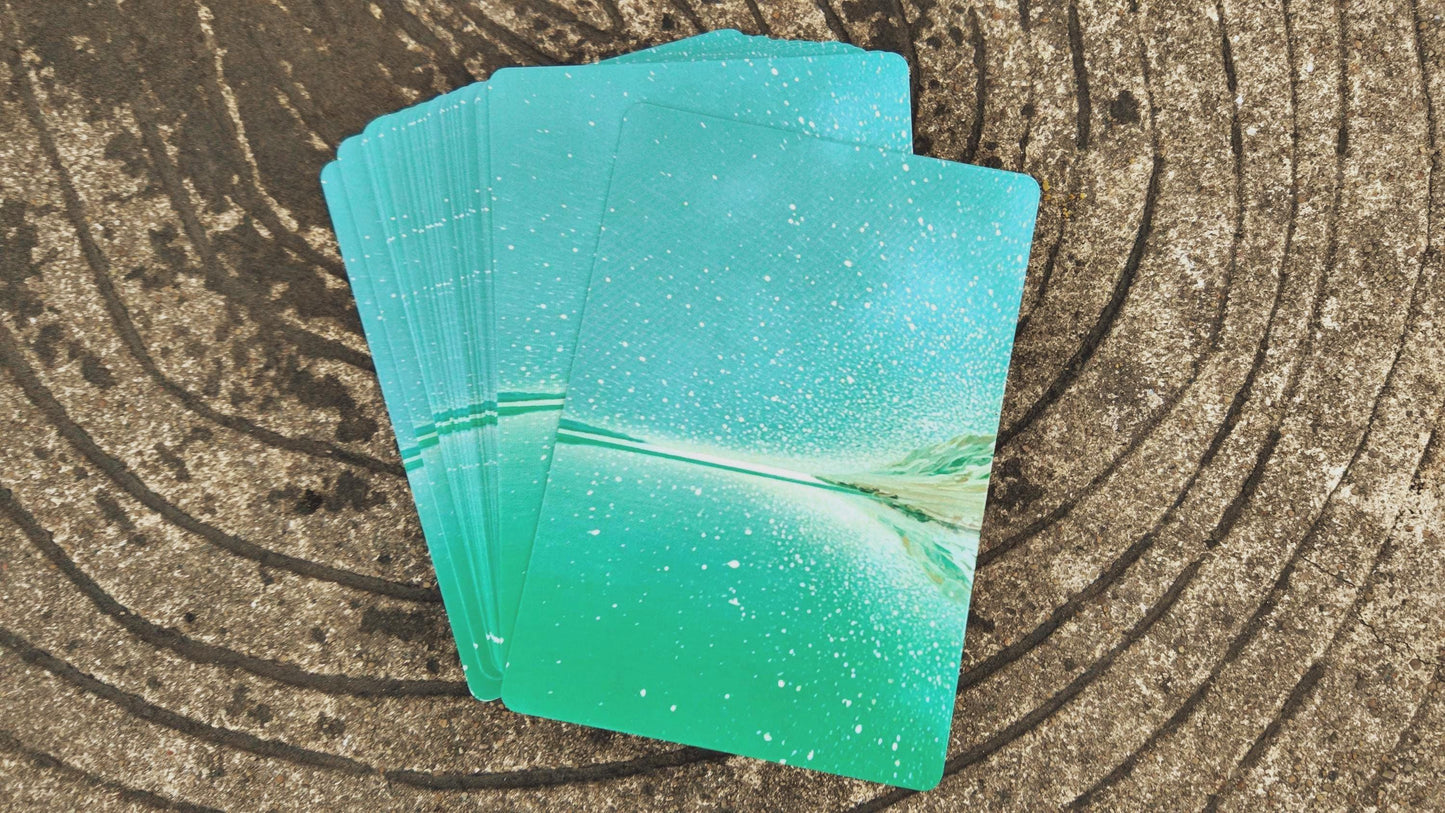 Ocean Healing oracle cards arranged in a fan on wooden surface