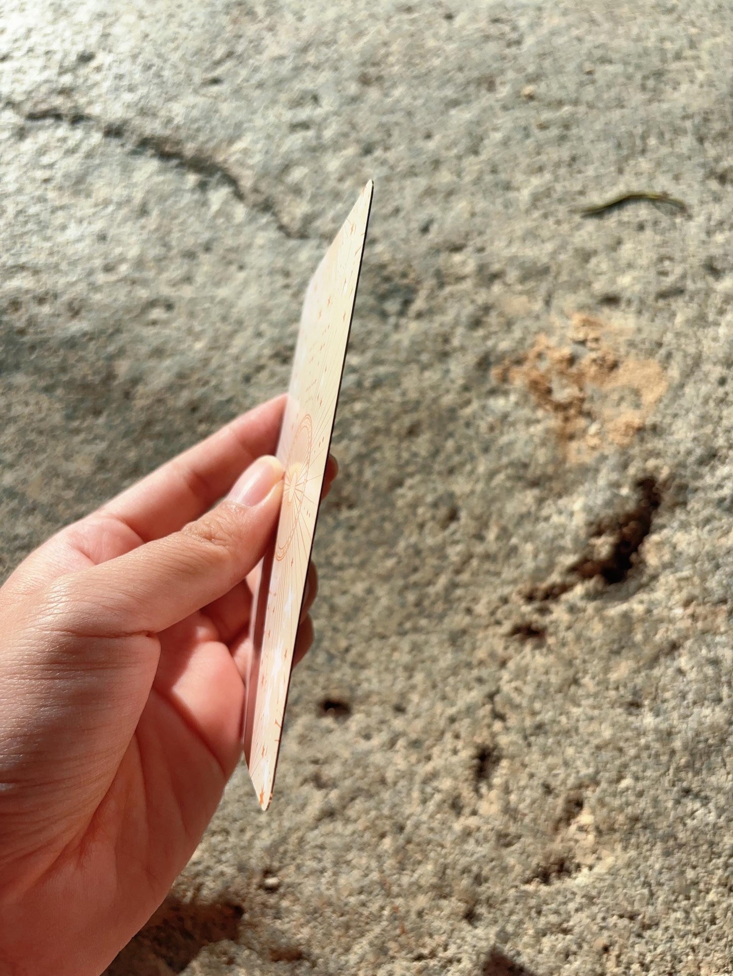 Side view of Abundance Oracle Deck showing card thickness and size
