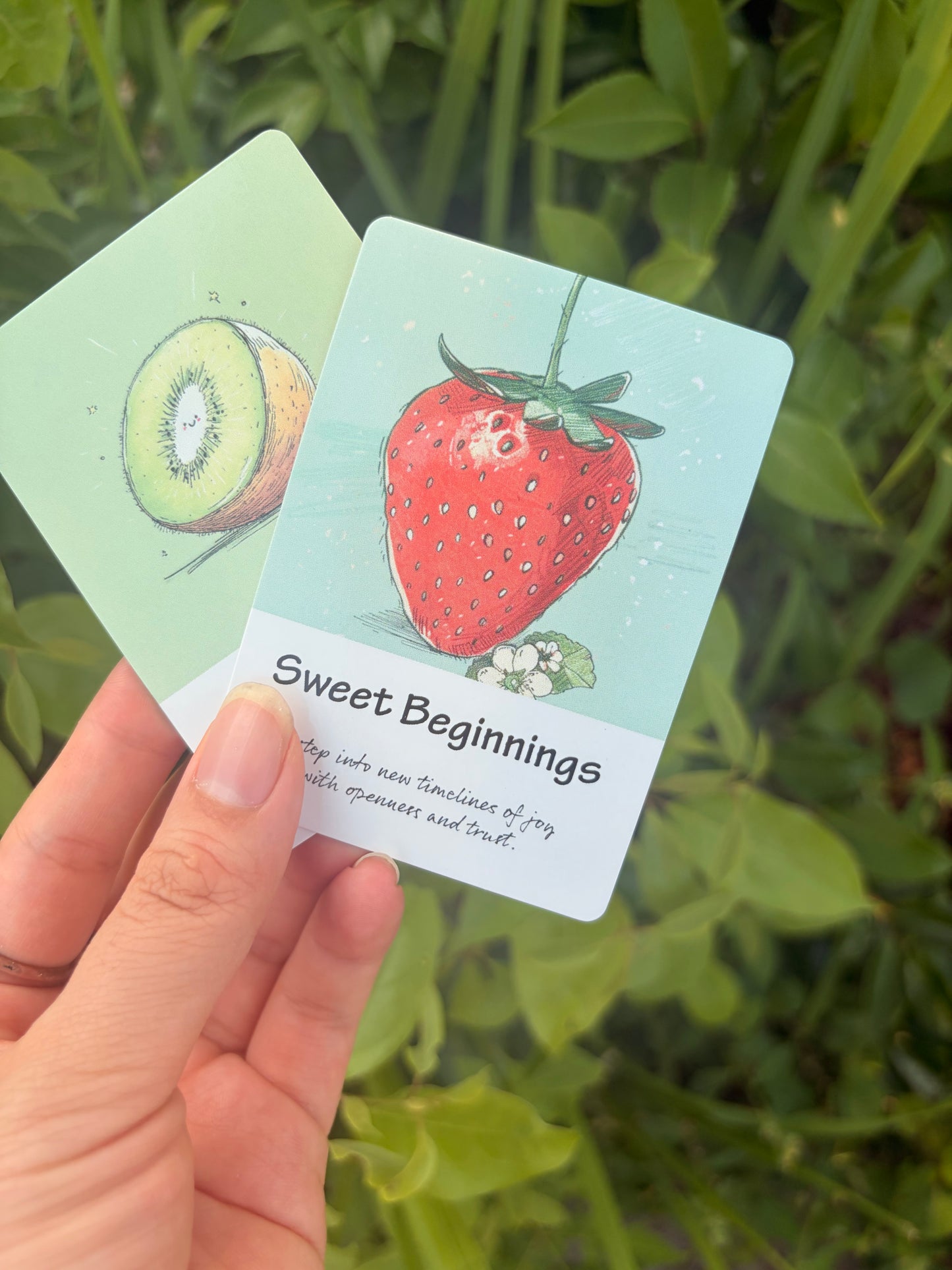 Sweet Beginnings oracle card from The Fruit Deck featuring strawberry artwork and guidance for personal growth.