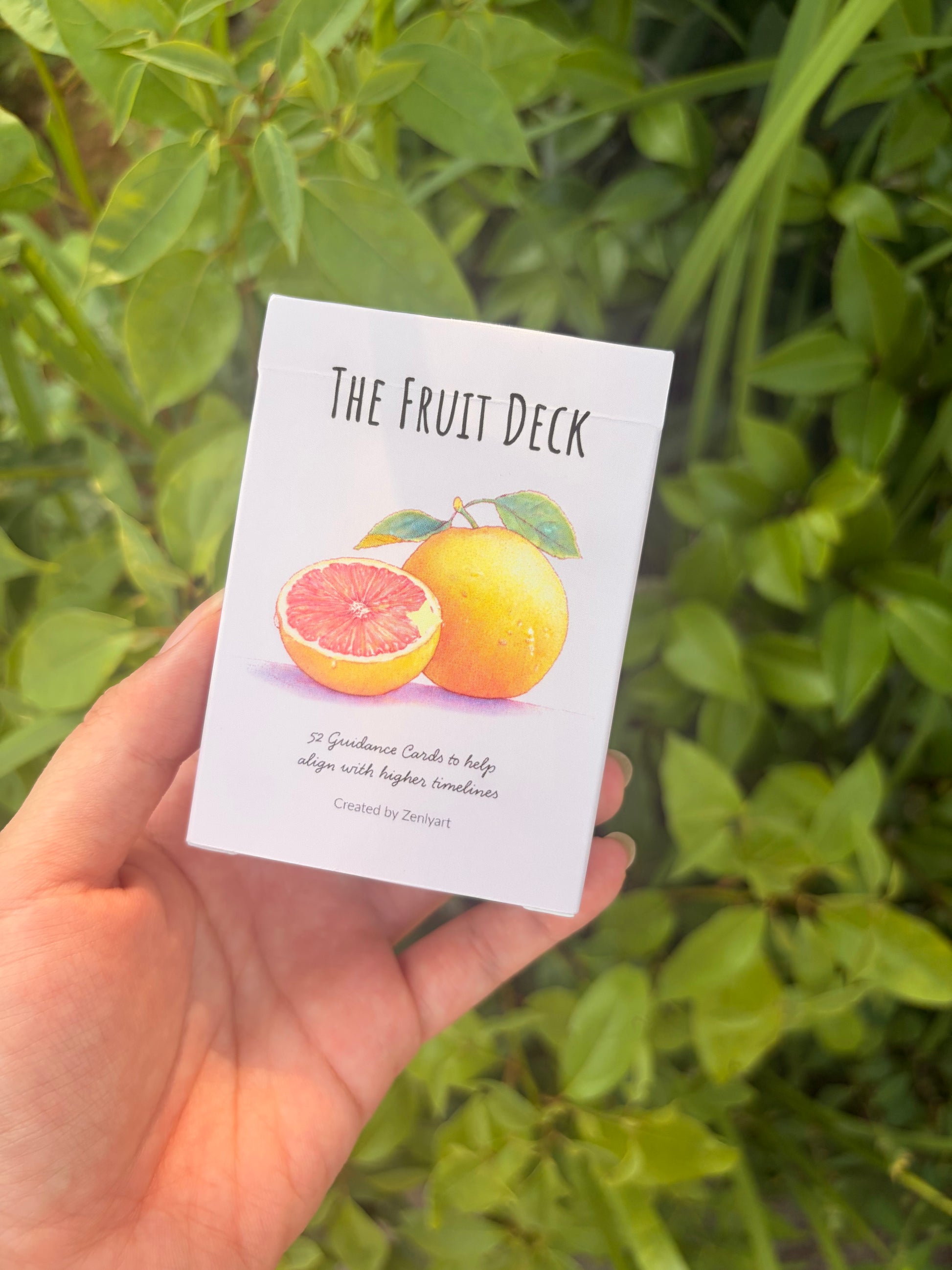 The Fruit Deck oracle deck featuring watercolor fruit artwork, 52 guidance cards, affirmations, and seasonal wisdom.