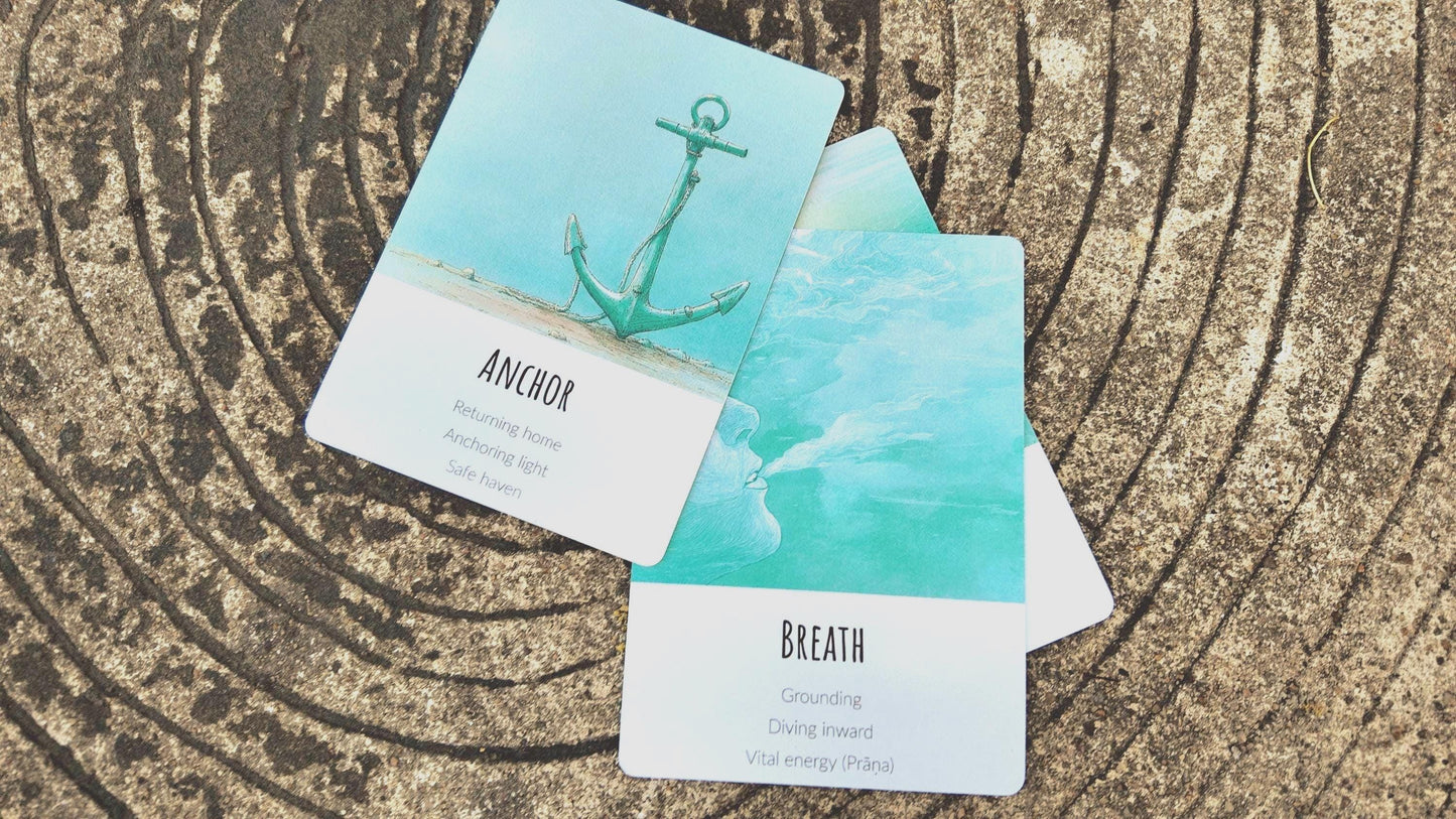 Two cards from Ocean Healing Deck with anchor and breath illustrations on a textured surface