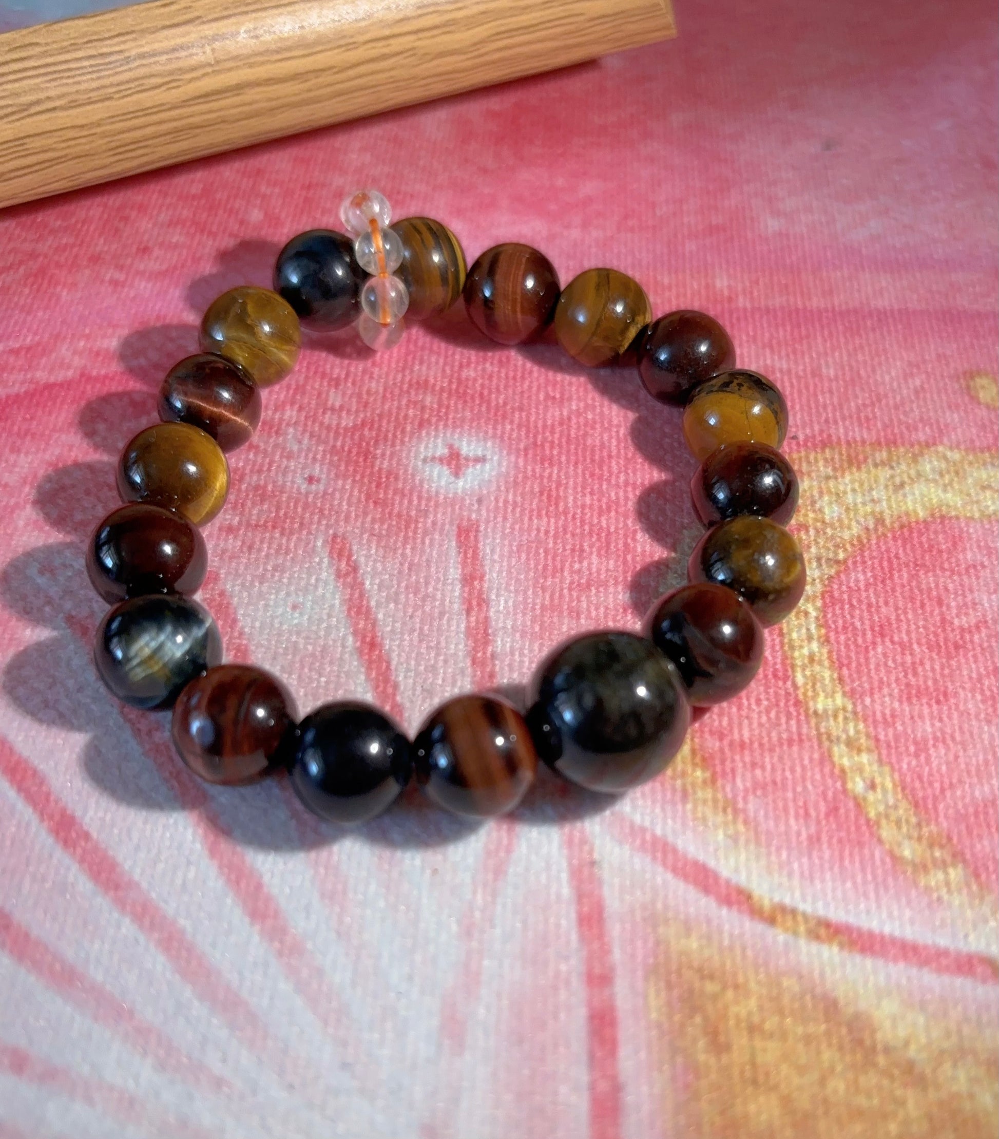 close up tiger eye beads mix red blue gold tiger eye with jade and citrine detail
