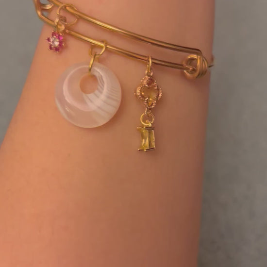 opalite charm bangle bracelet worn on wrist showcasing the styling
