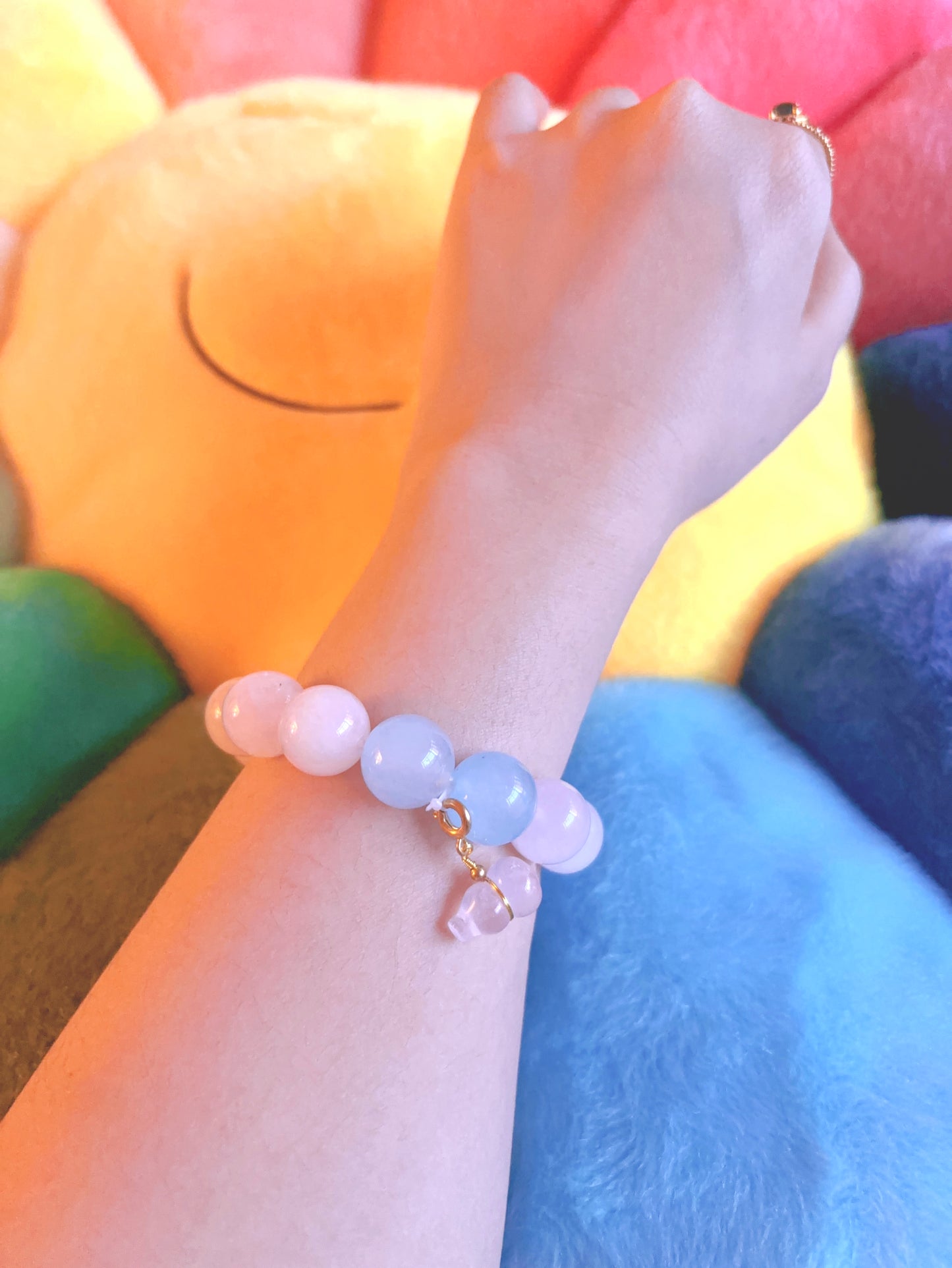 rose quartz aquamarine bracelet worn on wrist