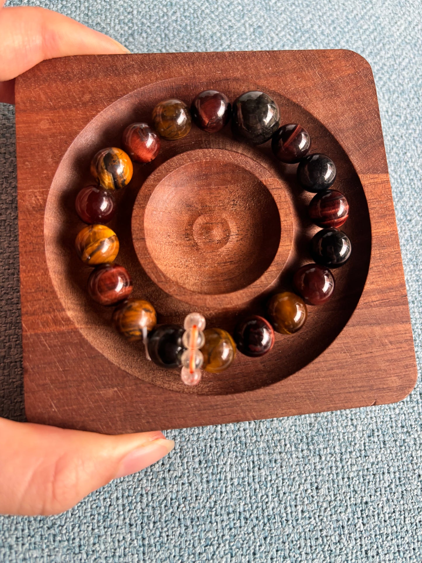 tri color tiger eye bracelet flat lay on wooden tray grounding crystal bracelet with jade and citrine